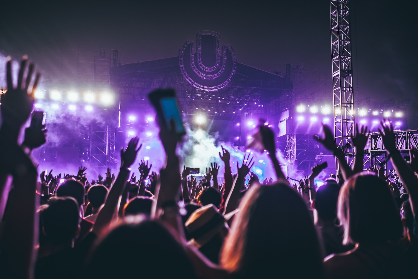 Night concert crowd with colored lights