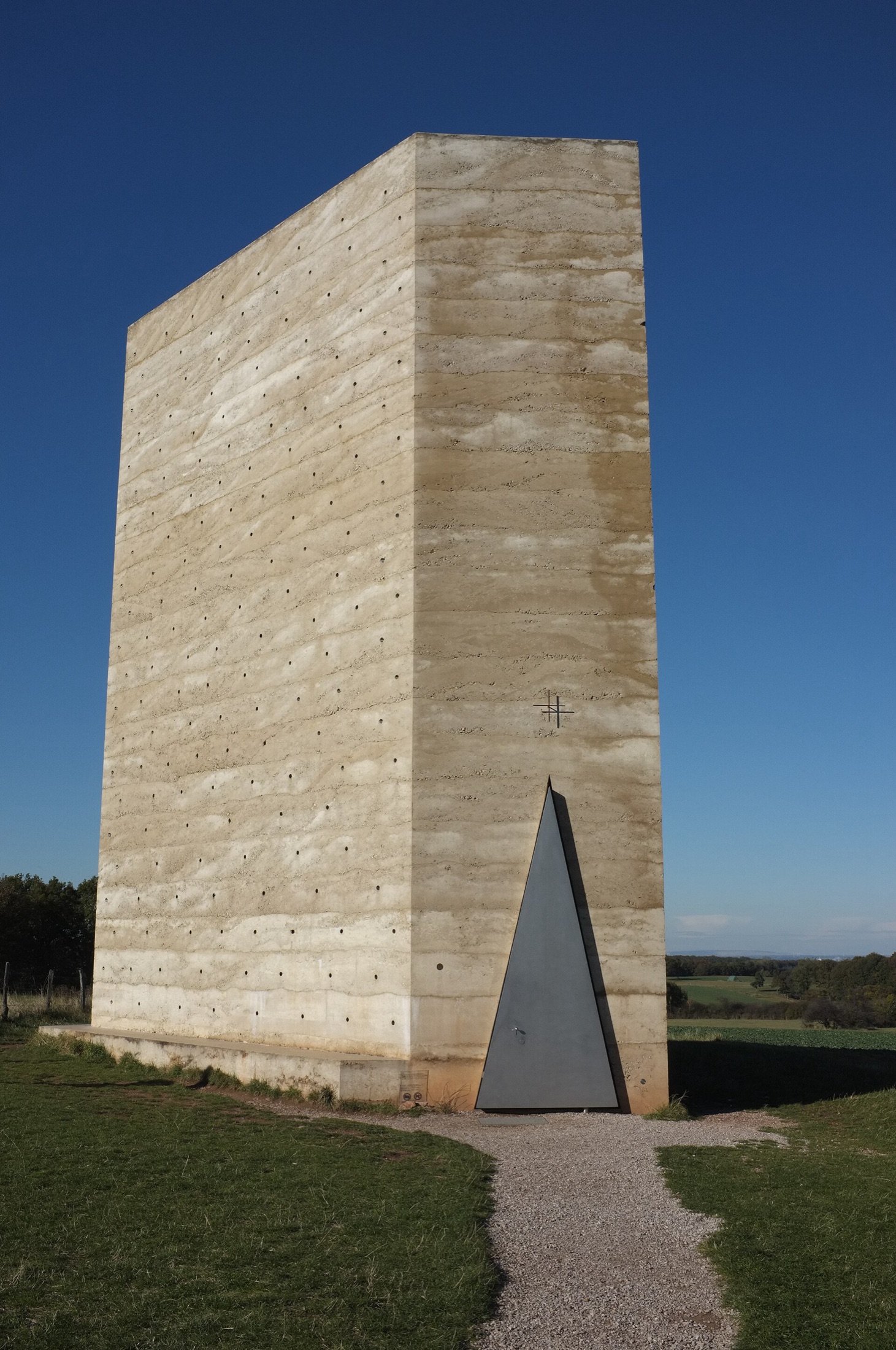 Field Chapel, a monolithic rammed concrete chapel standing alone in an open field